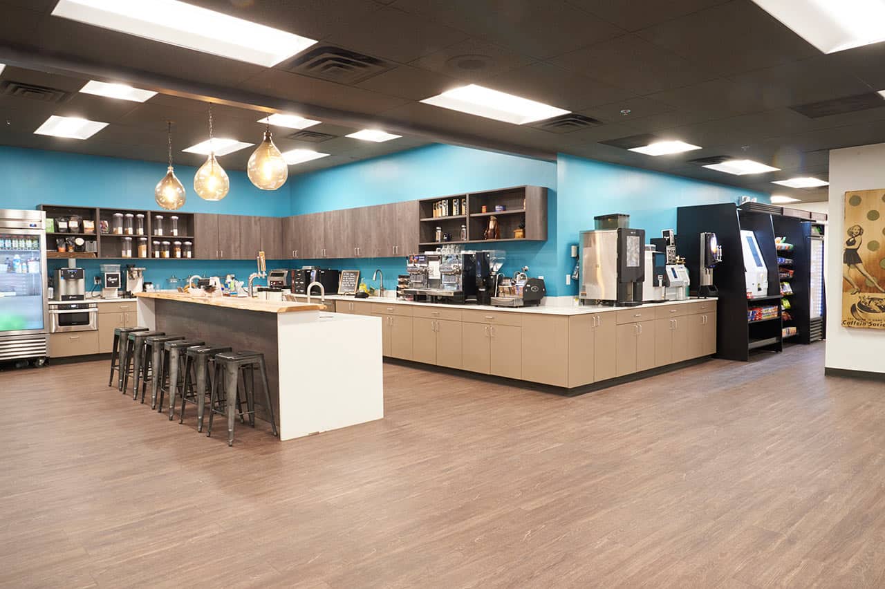 Open concept Office kitchen with branded accents to tie in the company's brand