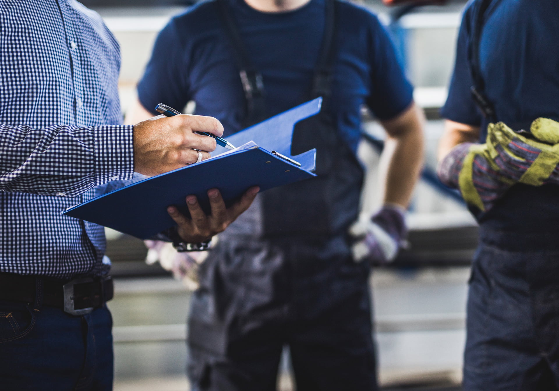 8 of the Most Common Facility Management Challenges in 2023 header image of facilities managers with clipboards