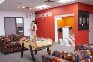 office breakout area with red walls and fussball table