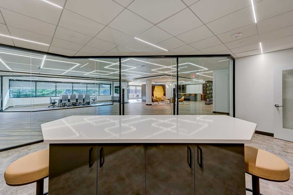 Beautiful interior design of workspace with wooden floors and white table - Phoenix