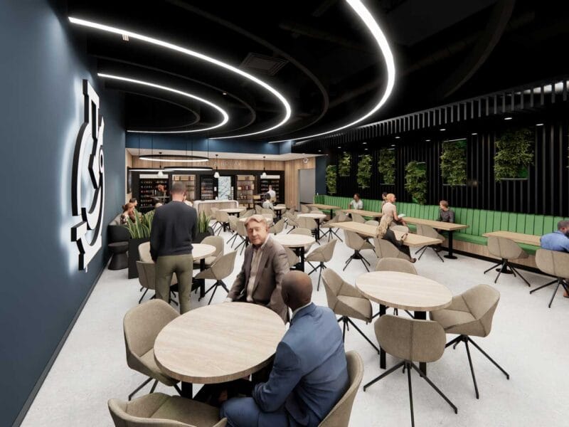 Cafeteria lounge at Pharmaceutical Campus with green seating, wood tables, and biophilic wall design.