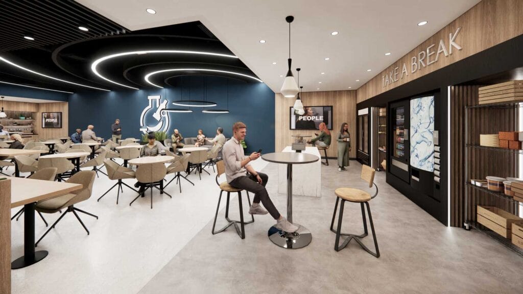 Spacious employee café with modern lighting, comfortable seating, and branded feature wall.