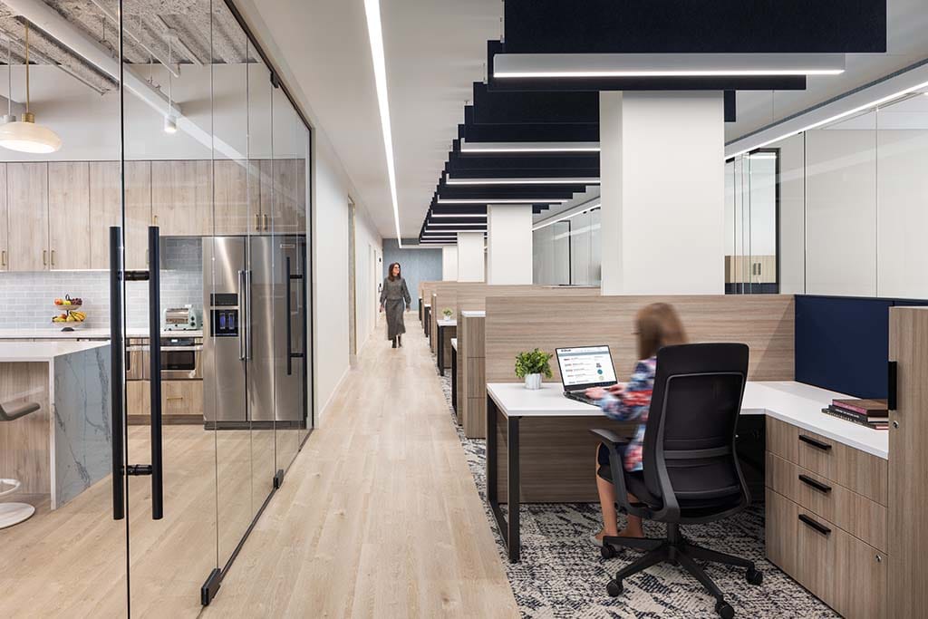 RI project image render of long spacious hall with glass offices and a receptionist 