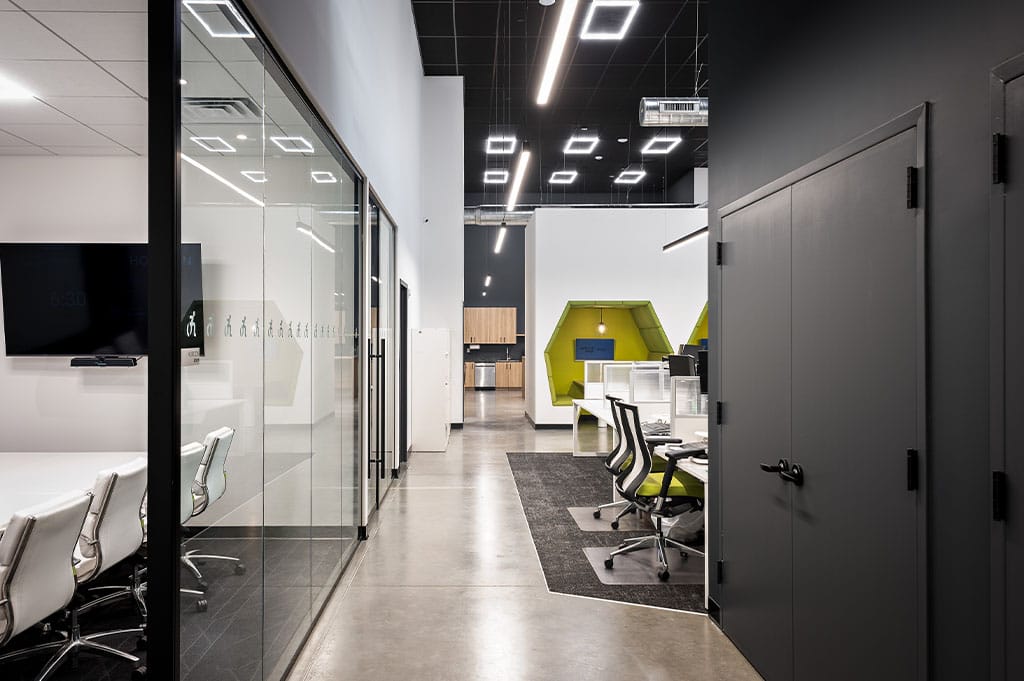 National Ramp project image of a large spacious office area, equipped with sound proof office meeting rooms, spacious office floor planning and small hub areas for focus work